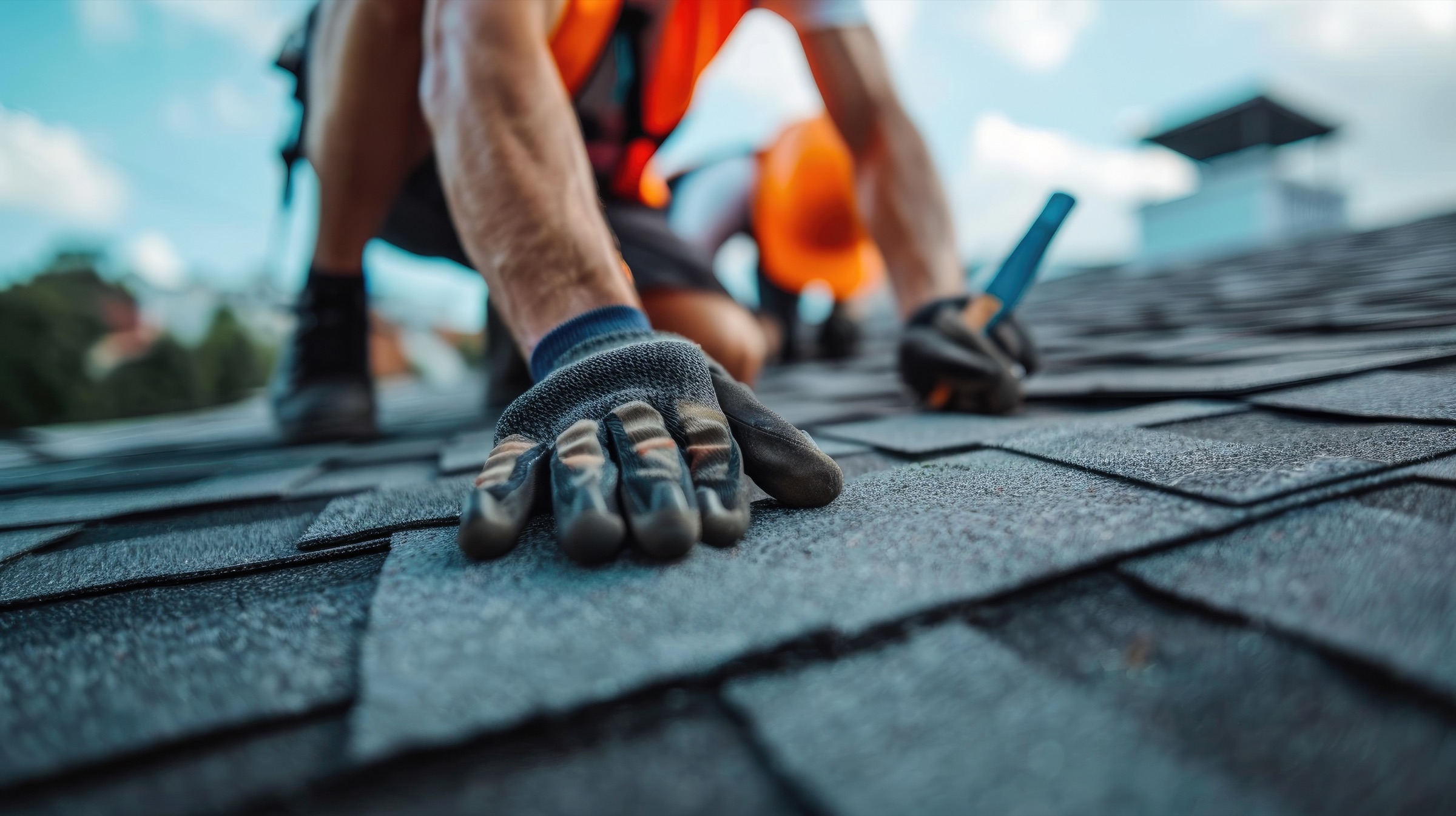 Roofing professional completing a residential roof installation